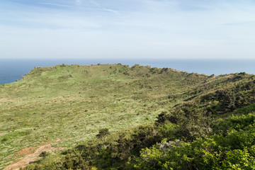 Fototapeta premium View of volcanic crater at the Seongsan Ilchulbong Peak on Jeju Island in South Korea.