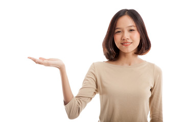 Beautiful young Asian woman show palm hand  isolated on white background