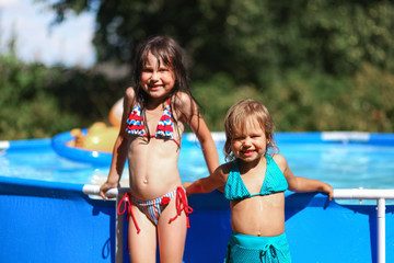 Children swim in pool.