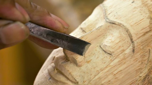 Video 1920x1080 - Workshops of Cambodia. Master of wood carving manufactures a statue