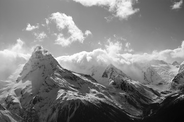 Black and white winter mountains with clouds