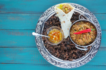 Flat lay Masala dosa with mint rasam