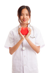 Asian young female doctor hold a red heart and smile  isolated on white background