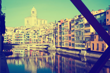  picturesque houses and church   from Eiffel bridge  in Gerona.