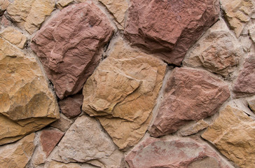 Fototapeta premium Old stone wall. / Wall of the old large stones, beige and brown shades