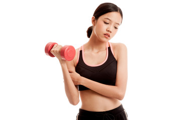 Fototapeta premium Asian healthy girl got arm pain with dumbbell isolated on white background