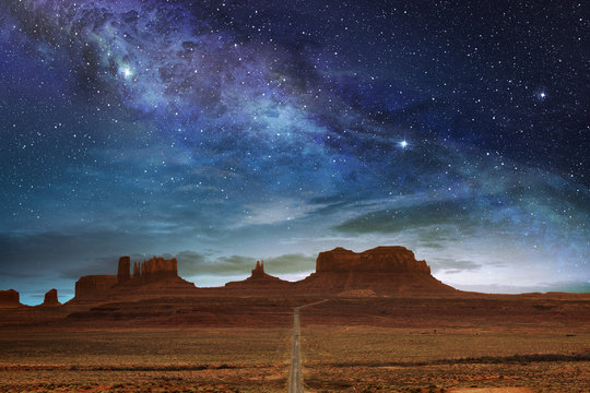 scenic route to the monument valley under a night starry sky