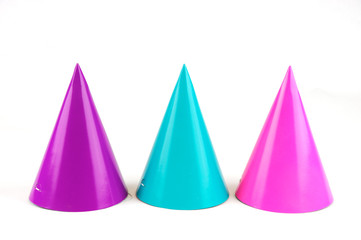 shiny party hats on white background