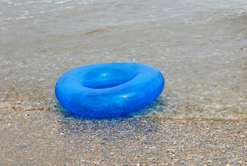 lifebuoy floating on water in the beach 