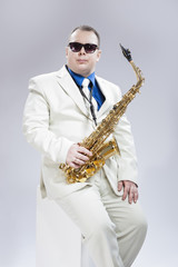 Fototapeta premium Music Concept and Ideas. Handsome Caucasian Musician With Alto Saxo