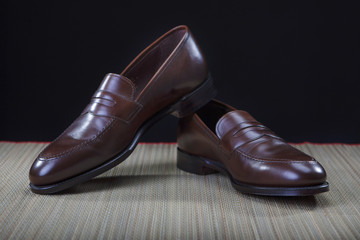 Footwear Concepts and Ideas. Pair of Stylish Expensive Modern Calf Leather Penny Loafers