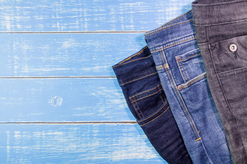 jeans on a blue wooden background