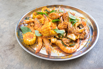 Fried shrimp ,squid and crab with basil with hot and spicy sour