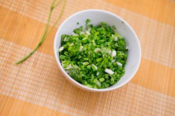 chopped green onions and coriander in bowl
