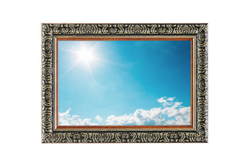 sun shines on blue sky with clouds in wooden frame isolated on w