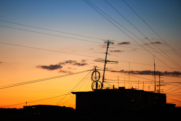 The roof of a residential house on a background of dawn