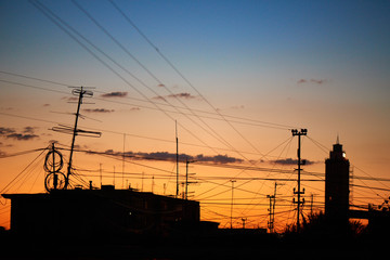 The roof of a residential house on a background of dawn