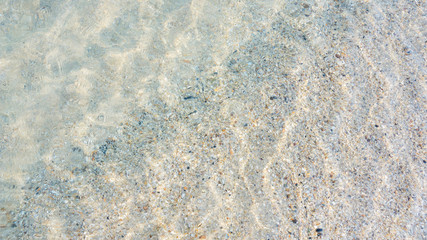 Wave of the sea on the sand beach.