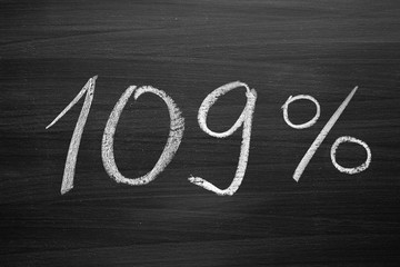 109 percent header written with a chalk on the blackboard