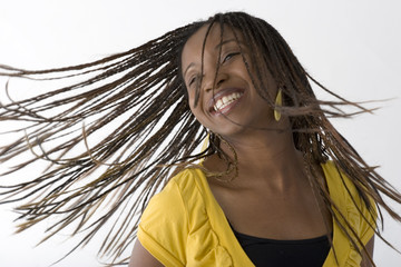 Young African woman dancing, isolated on white
