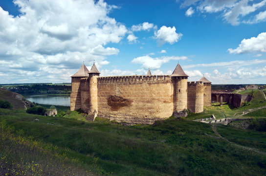 Khotyn castle on Dniester riverside. Dramatic blue sky. Ukraine