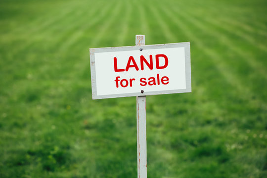 Land for sale sign representing premium domain opportunity