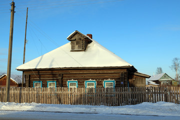 House in a village in a winter day