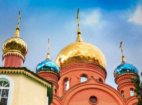 bright domes of the Orthodox Church against the clear blue sky