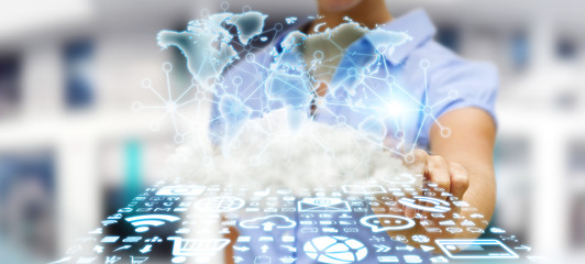 Businesswoman holding world and cloud © sdecoret