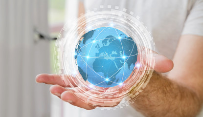 Businessman using digital tactile world interface with his hand