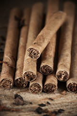Cigars pile on wood