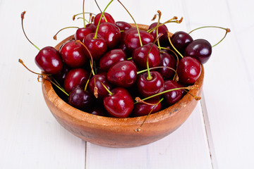 Fresh Cherry in Wooden Bowl