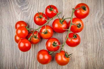Cherry tomatoes on wooden background