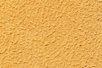 Plastered concrete surface with an uneven rough texture