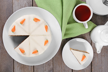 Delicious carrot cake with tea, top view