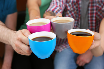 People holding coffee cups
