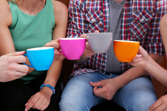 People holding coffee cups