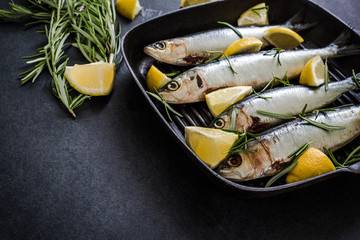 whole fish sardin on frying pan