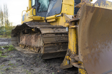 Fototapeta na wymiar yellow excavator close-up