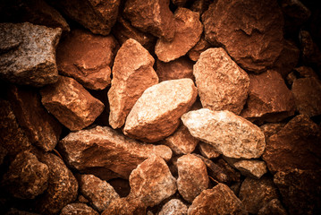 Red brown stones natural texture background top view