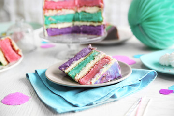 Colorful cake slices on white festive table