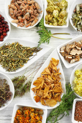 Natural flower and herb selection in ceramic bowls, close up