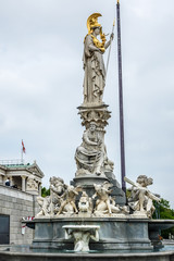 Fototapeta na wymiar Pallas Athena fountain near Parliament Building. Vienna, Austria