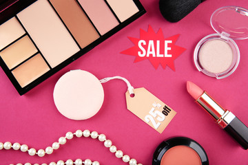 Make up product on pink background. Sale concept