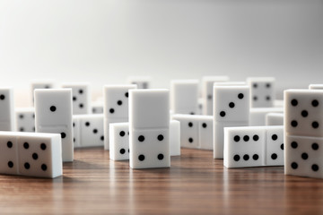 Heap of dominoes on wooden background