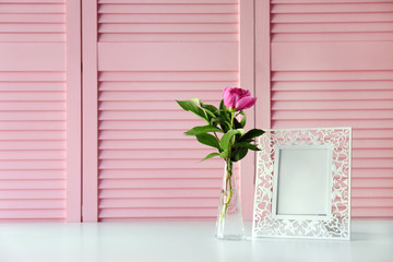 Beautiful peony flower on pink folding screen background
