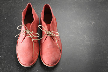 Red shoes on dark grey background