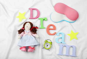 Sleep concept with accessories on color background