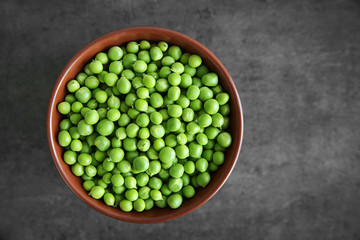 Fresh green peas in bowl, closeup