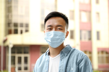 Ill man wearing mask on the street